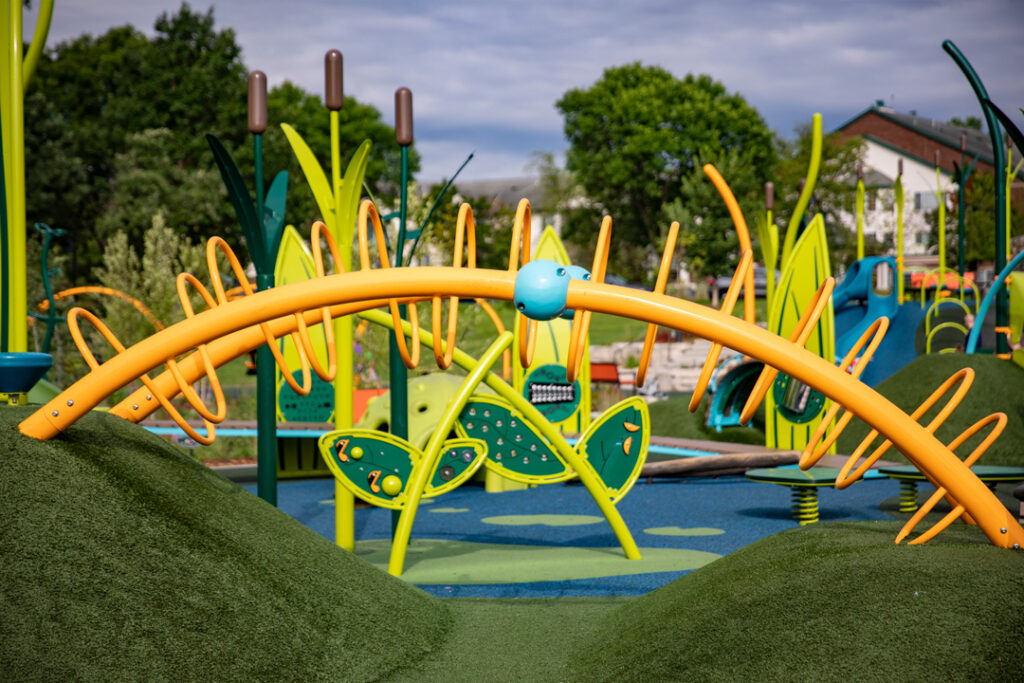 playground with hills of artificial turf